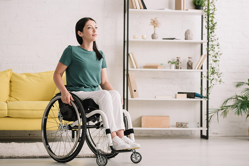 disabled woman in white ultralight wheelchair